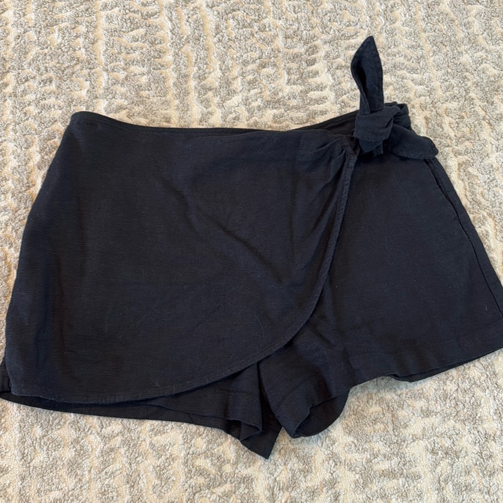 Anthropologie black mini wrap skirt. Size 10.